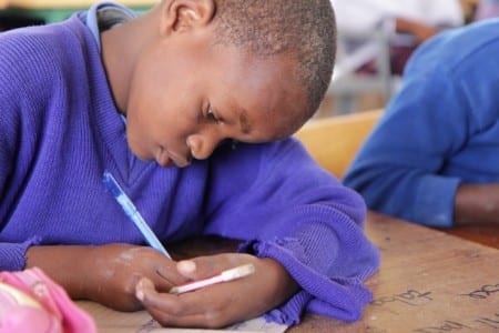 A child learning at Dodoma School for the Deaf